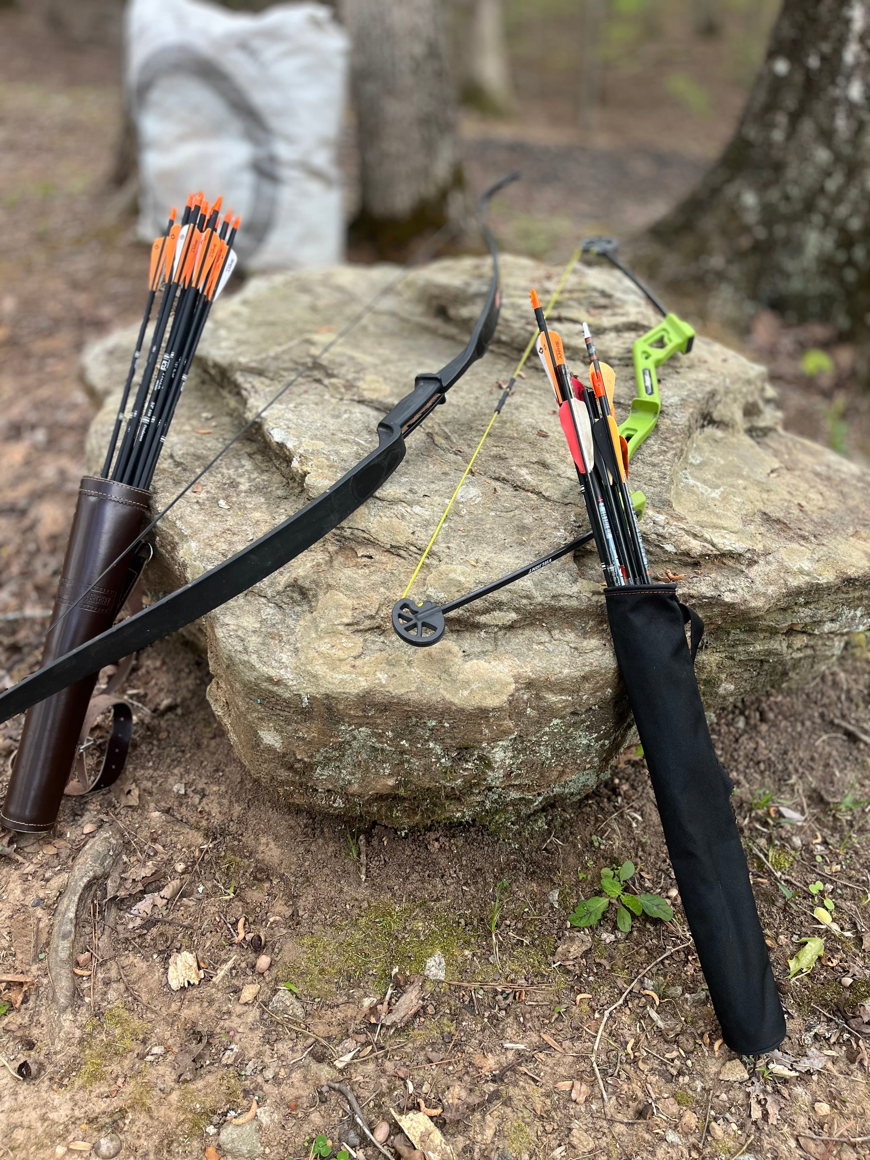 Bow and arrow setup on natural rock