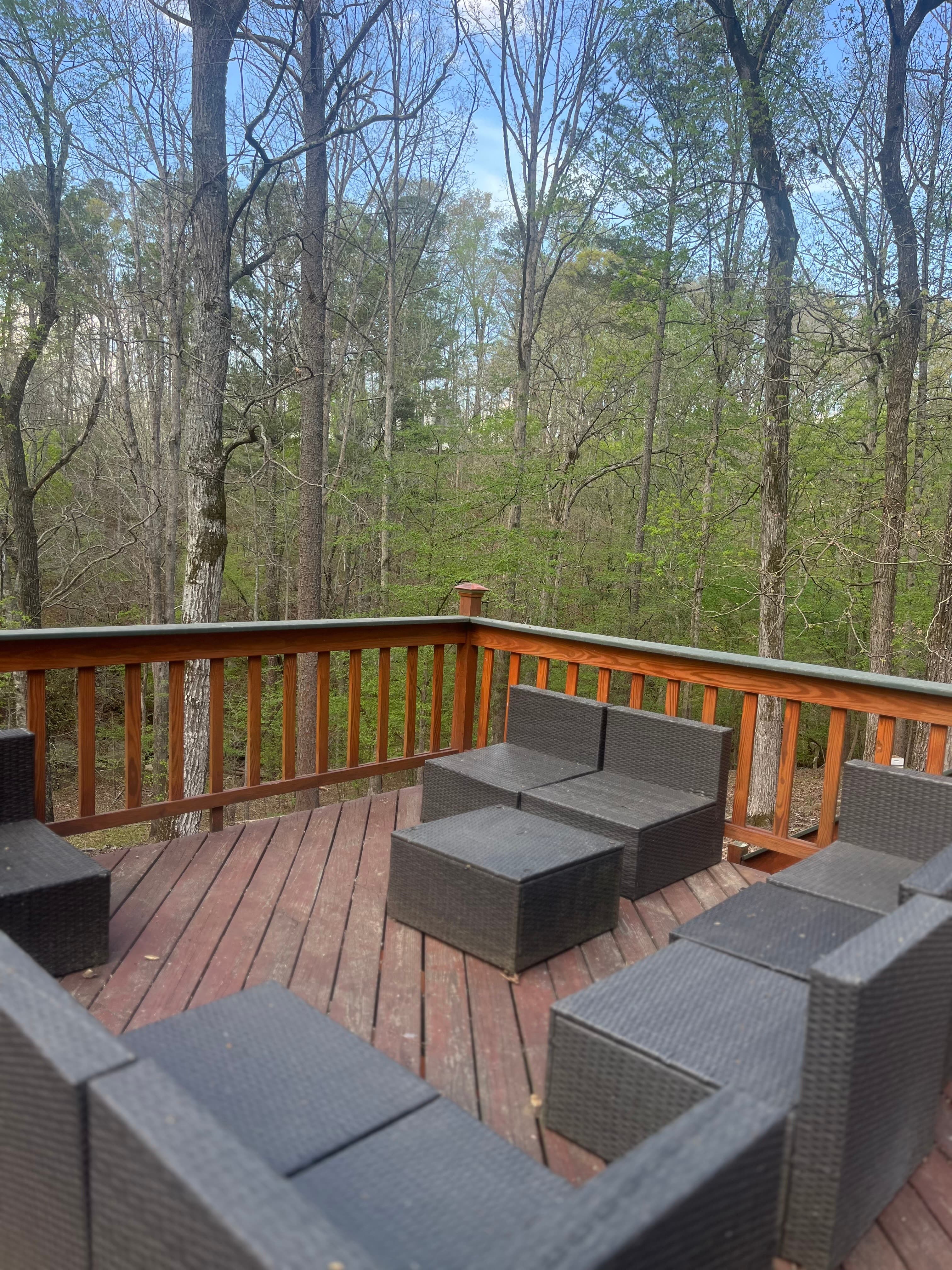Deck seating overlooking the forest canopy