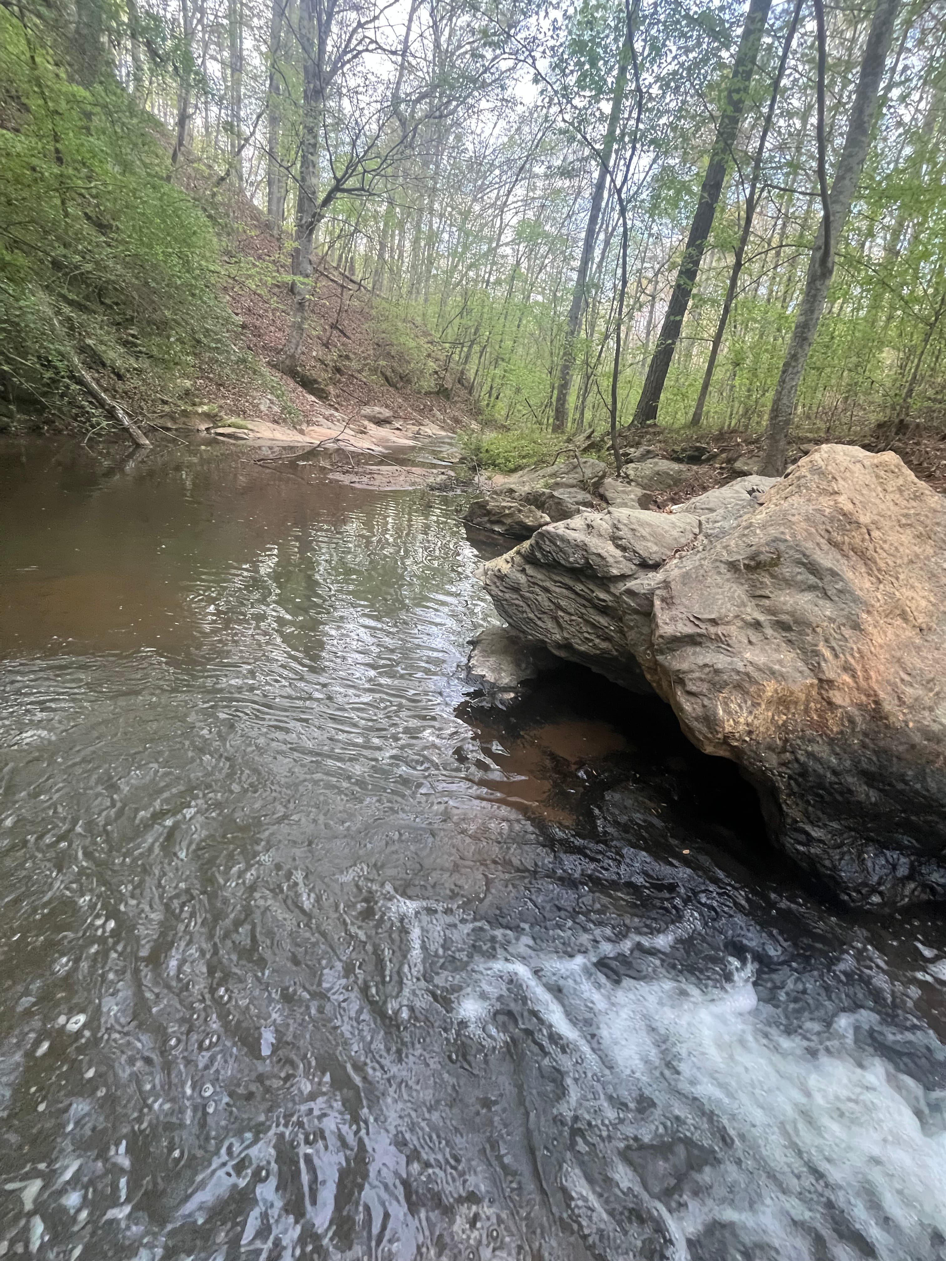 Waterfall flowing over natural rock formations